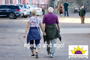 Image of an elderly couple walking to Sun Pain Management