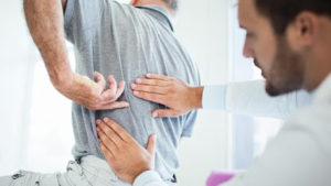 Image of a doctor treating a patient with back pain at the Pain and Spine Specialists of Pennsylvania